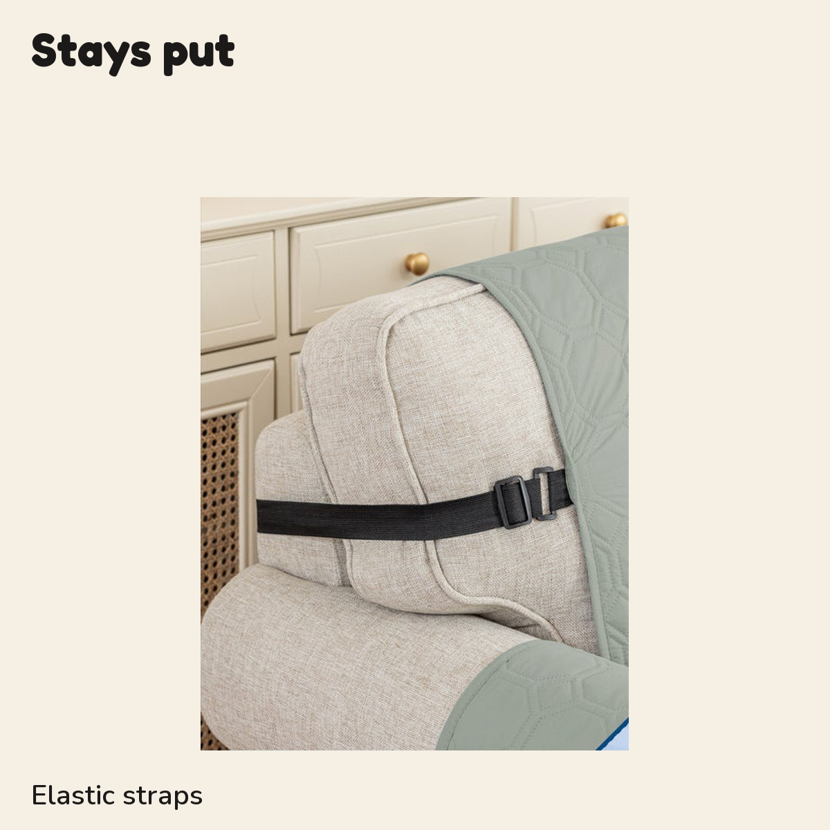 Elastic strap holding the quilted sofa cover in place around the seat cushion