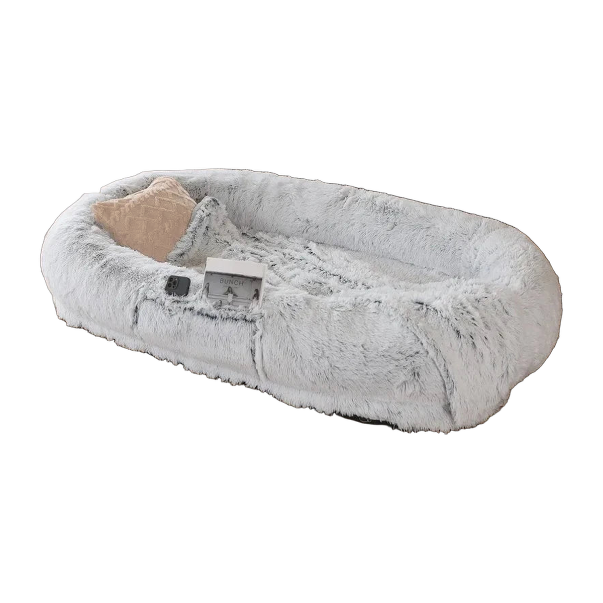 Grey faux fur human-size dog bed with a raised rim and pillow, white background
