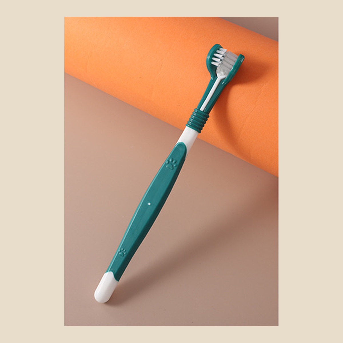 Teal and white three-sided dog toothbrush