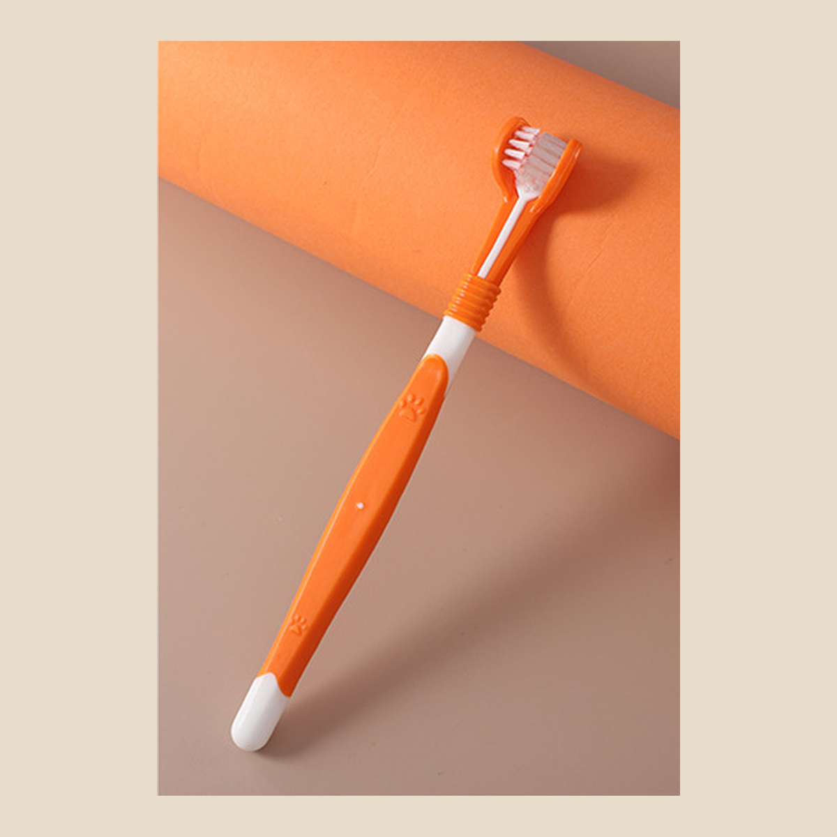 Orange and white three-sided dog toothbrush