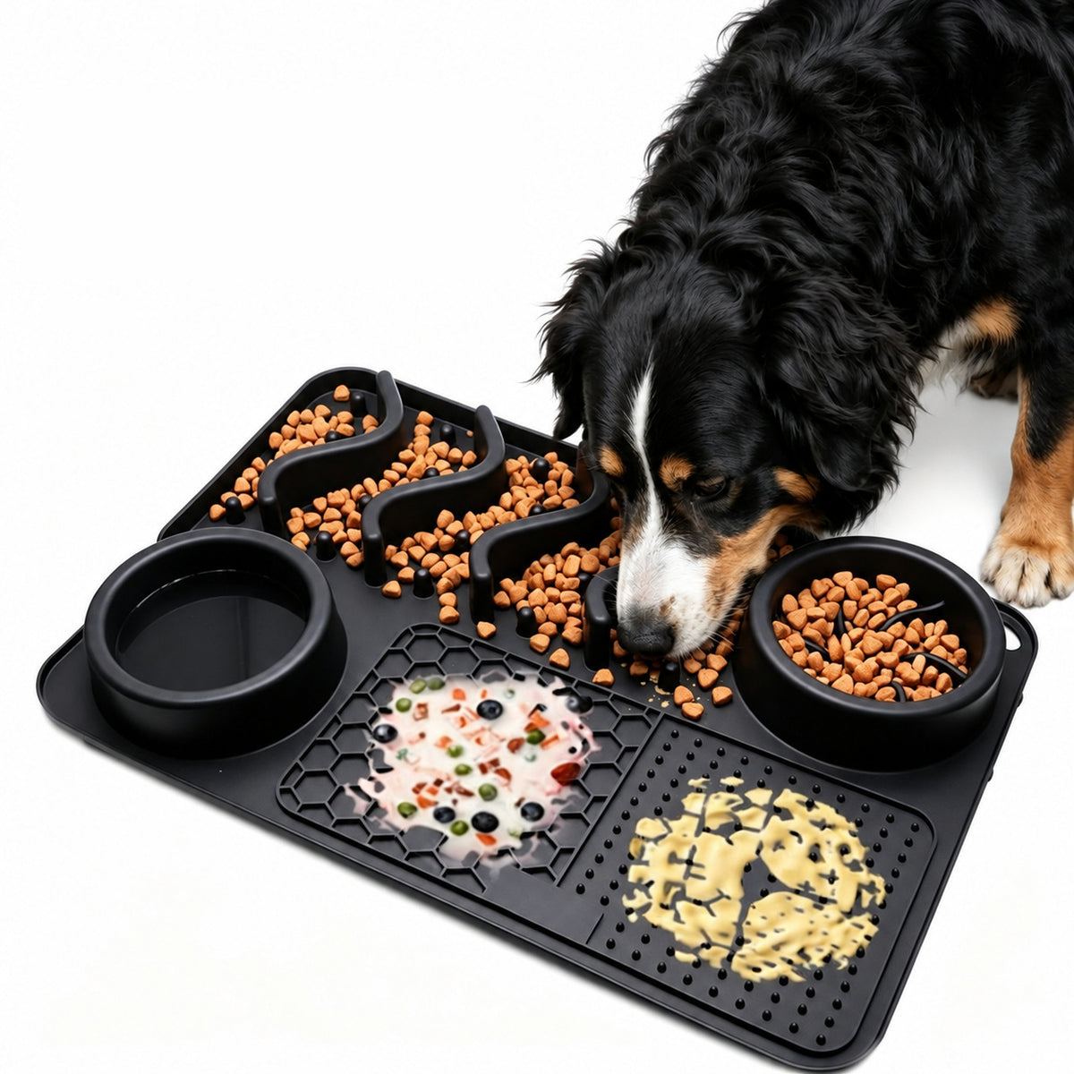 Large tray in Black, loaded with kibble in the S-shaped channels, yoghurt on the honeycomb panel and paste on the pimpled panel, with a Bernese mountain dog eating from it